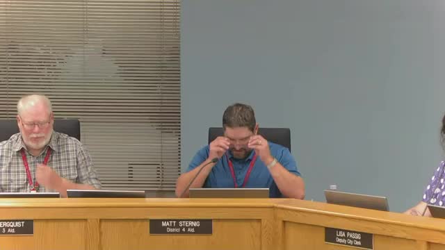 Finance committee adopts resolution waiving some storm‑repair permit fees and adding emergency declaration after flood