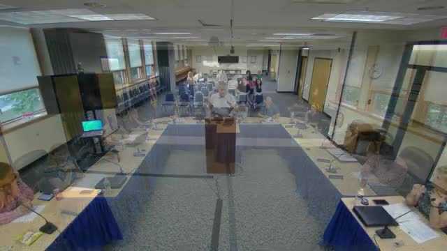 Resident questions recurring settlement payments and district borrowing; superintendent cites limits on public comment and a pending grant-funded project