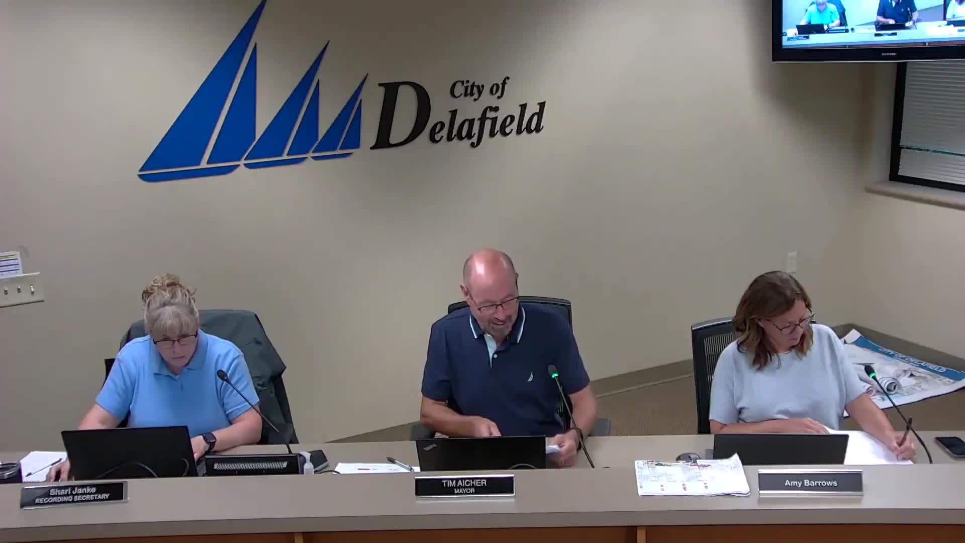 Plan commission approves metal roof for Kettle Court East dumpster enclosure, asks contractor to compact base