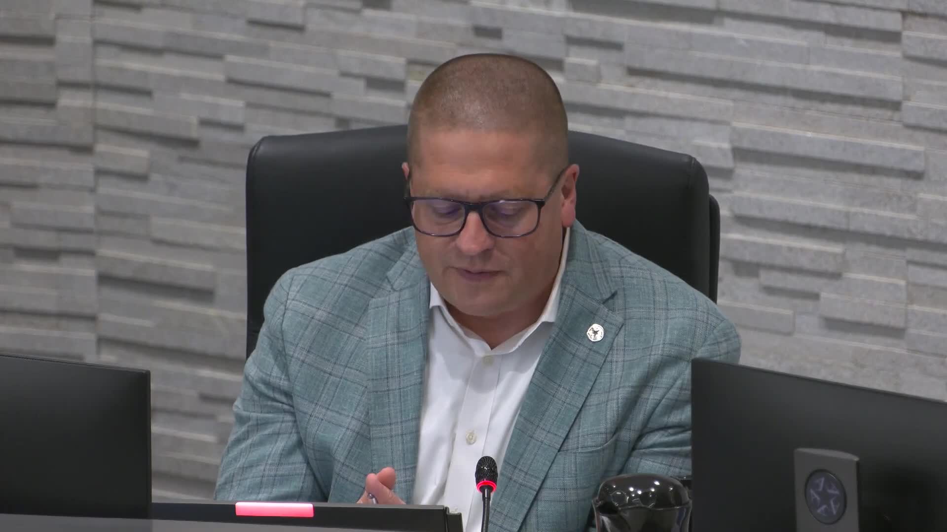 Arlington ISD adopts 2025–26 tax rate, authorizes defeasance authority; trustees debate 'apples-to-oranges' calculation