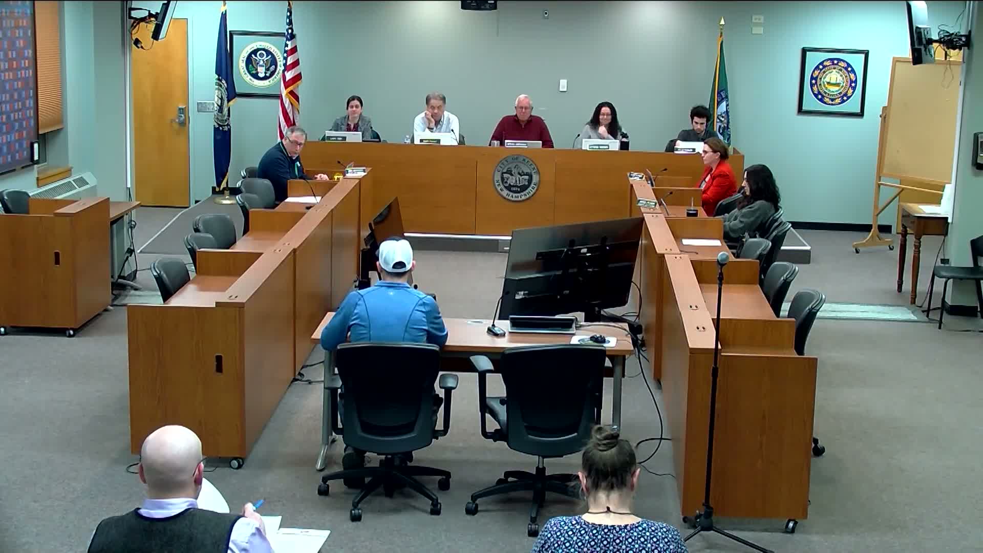 Downtown business proposes banner poles; public works outlines costs and legal issues