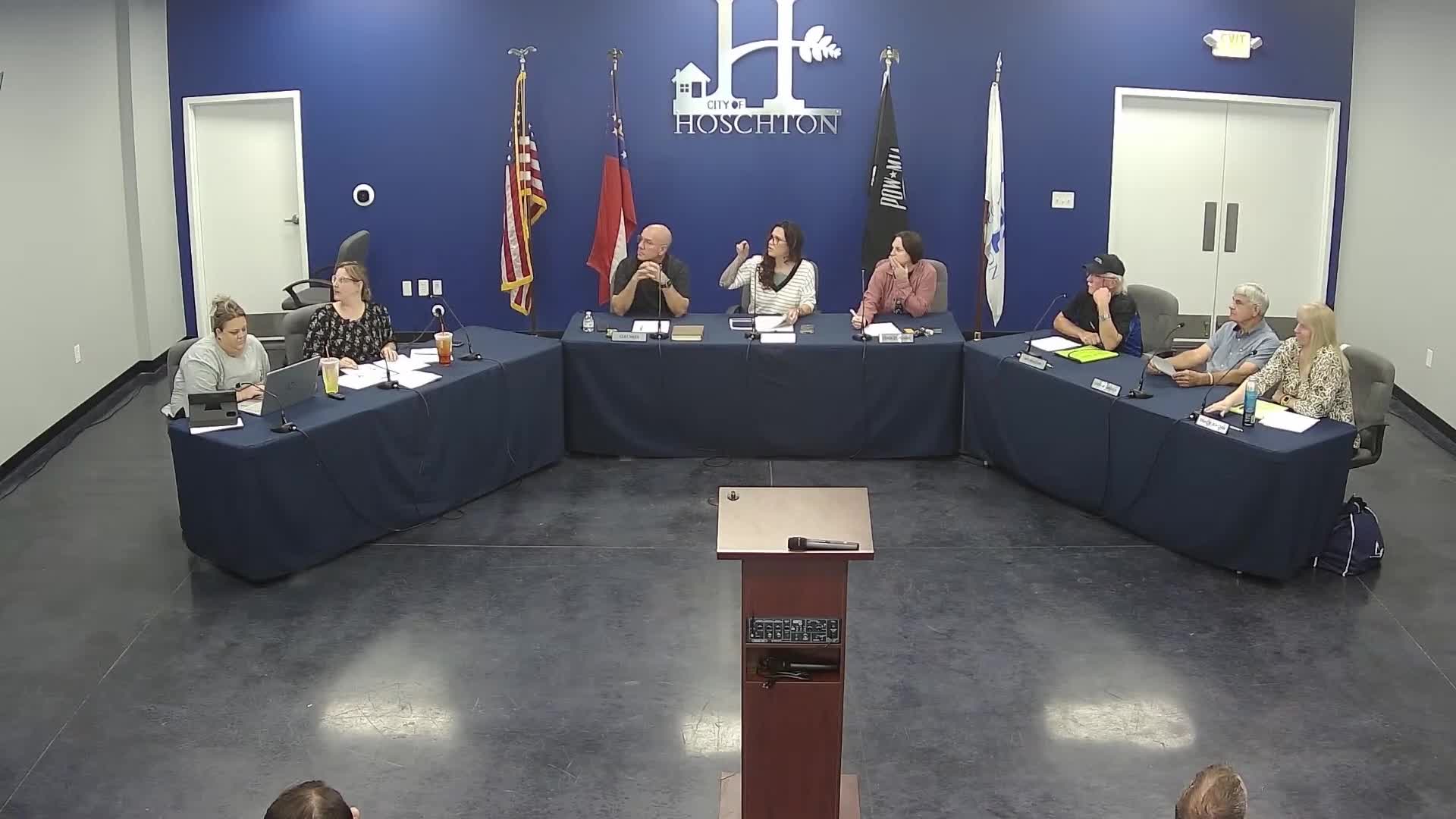 Hushton DDA pauses logo approval after member feedback, tables decision