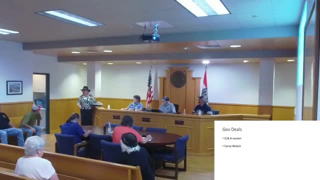Carrie Welch presents Gut Deals auction options to county officials