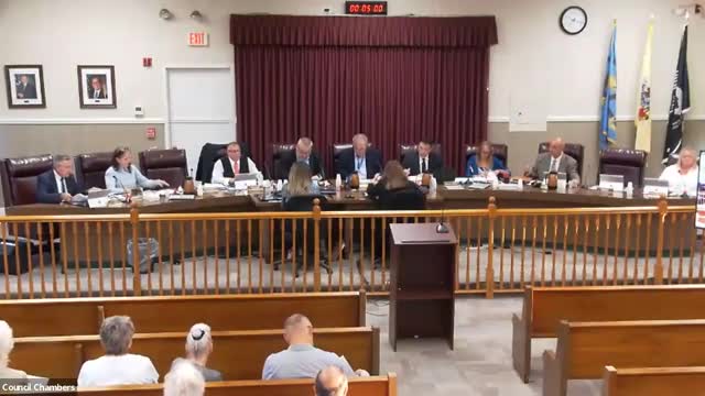 Council adopts ordinance tightening parking‑area and front‑yard design standards in residential districts