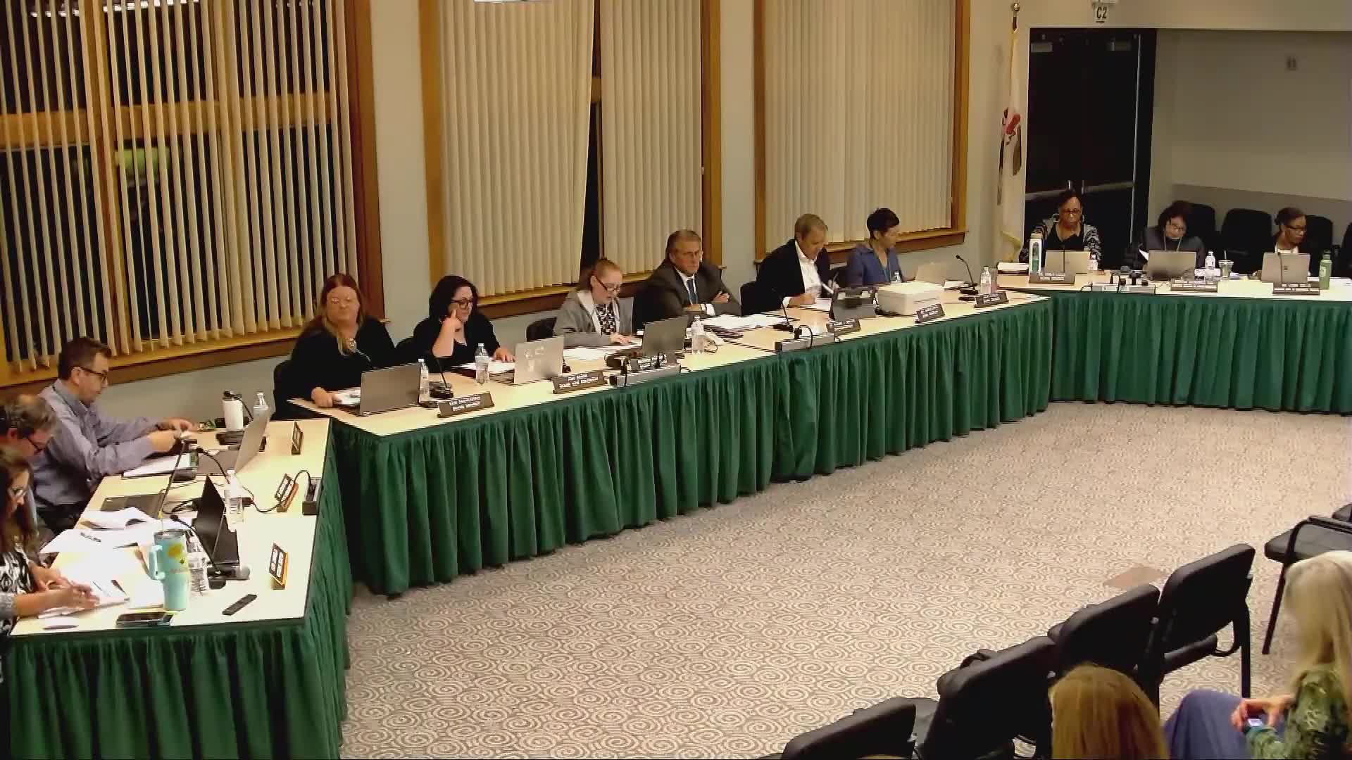 Woodland board approves benefits and contract provisions; HR report passes with one abstention
