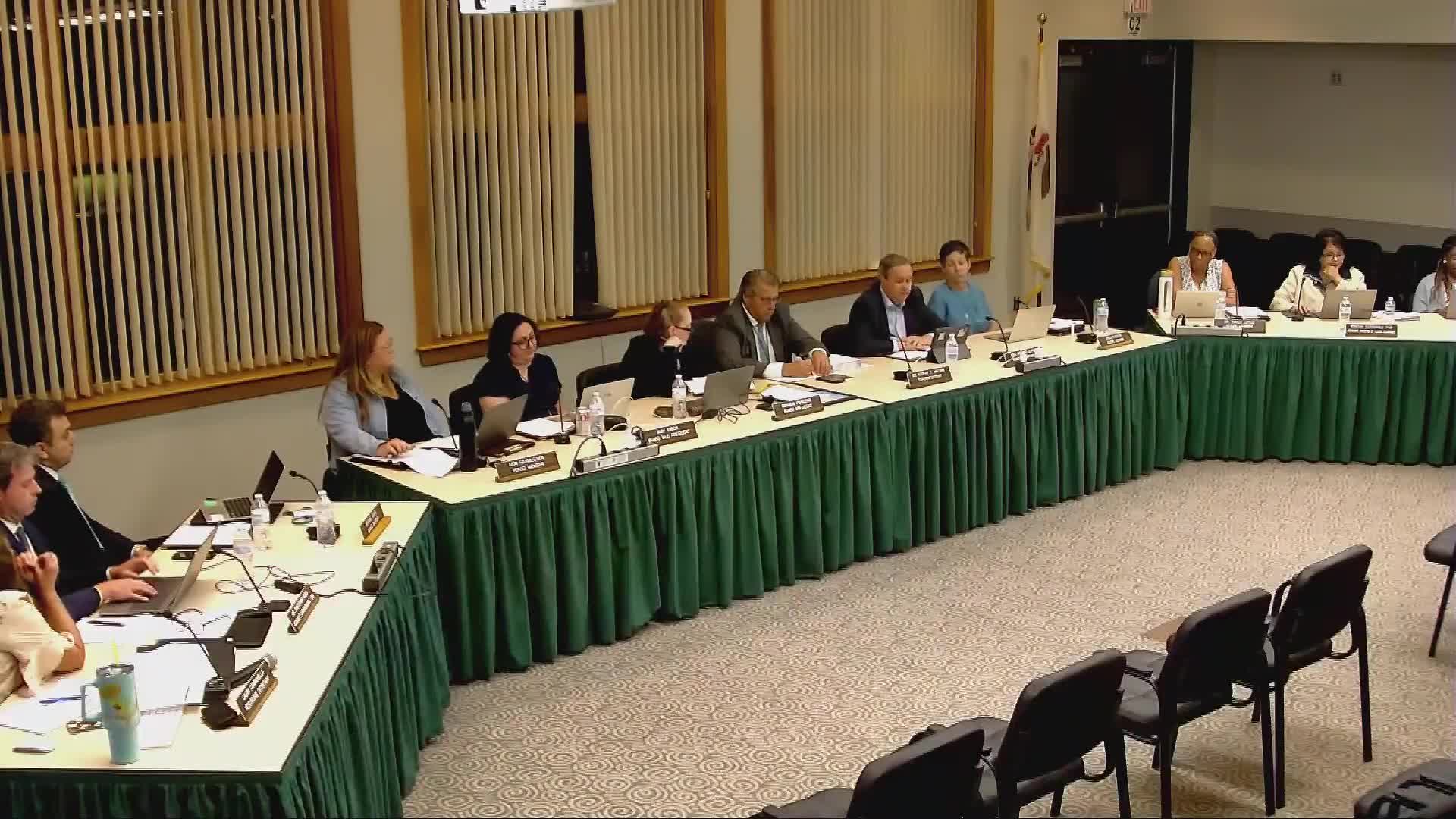 Board members debate adopting attendance/abandonment policy after prior absences