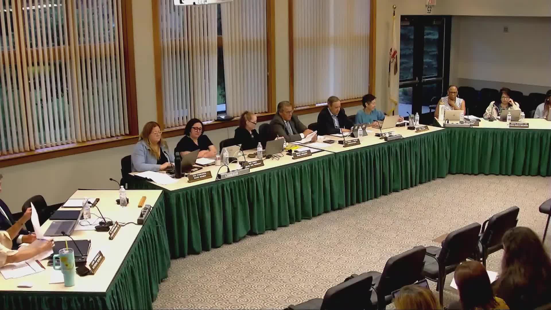Board approves restorative‑practices hire amid debate over HR reporting and transparency