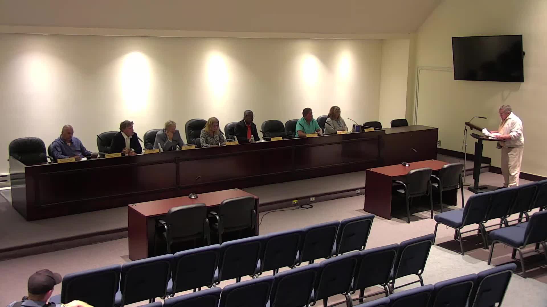 Resident criticizes tax abatements and budget surplus; officials explain municipal role in tax collection