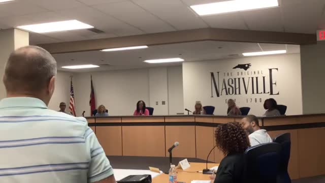 Downtown hanging baskets planted; board suggests larger flower budget next year