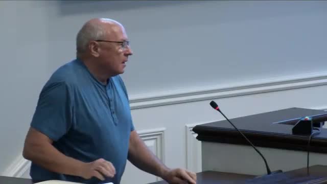 Hearing officer approves variance for narrow Old Town lot at 120 Third St. NW after neighbors raise drainage and parking concerns