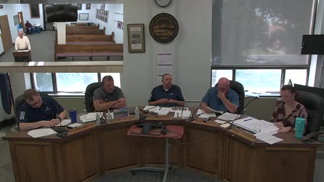 Commissioners discuss selling surplus metal covers and equipment on Purple Wave; skid steer sale deferred pending usage check