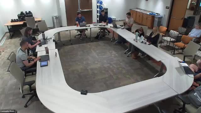 Board discusses Project Downtown financing options and Geneva Village’s future; public speaker urges retaining city-owned parcel