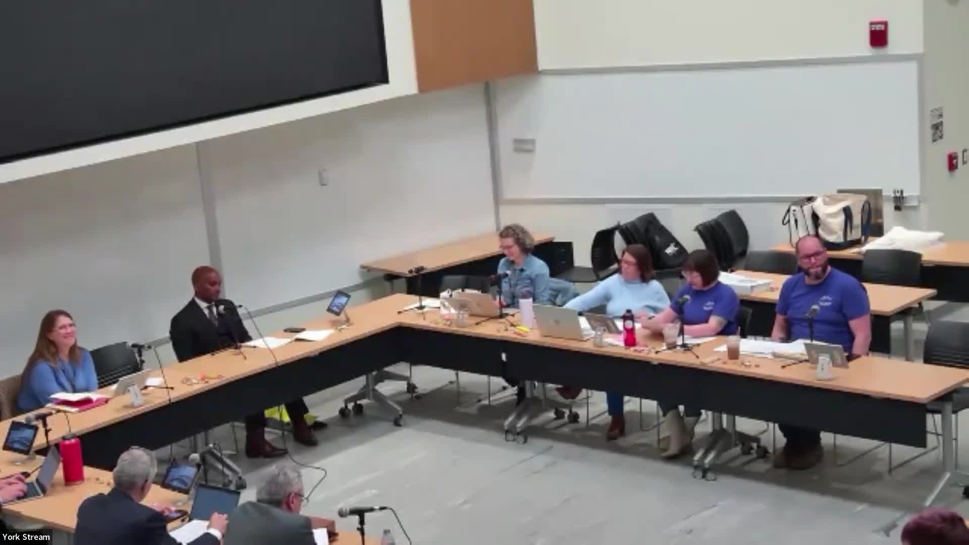 Union pushes protections against AI outsourcing; district urges policy coordination with state and federal guidance