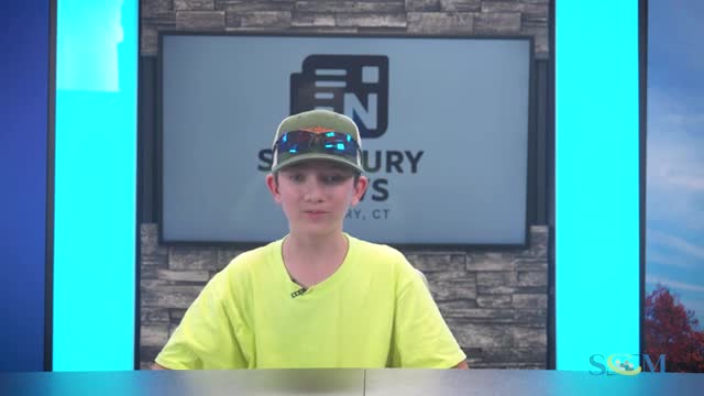 Drive-through development progresses; presenter sees retaining wall and hydroseeding but contractor unclear