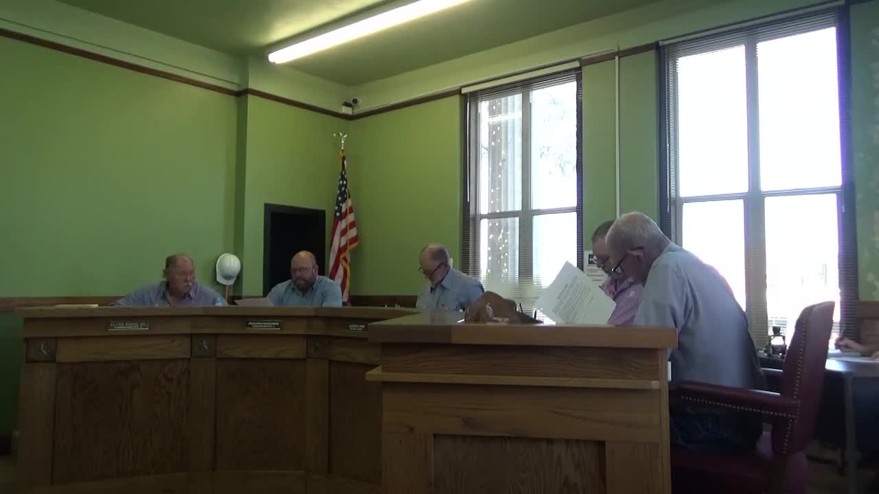 Commissioners move to group $100,000 bonds for county roads; constable bond and oath noted