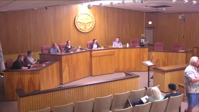 Zoning board approves 18‑inch KeyBank wall with planted bed; requires 30–36 inch plant height