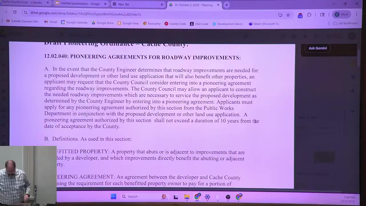 Planning commission debates 'pioneering' road-cost repayment draft; asks staff to tighten collection and notice mechanisms