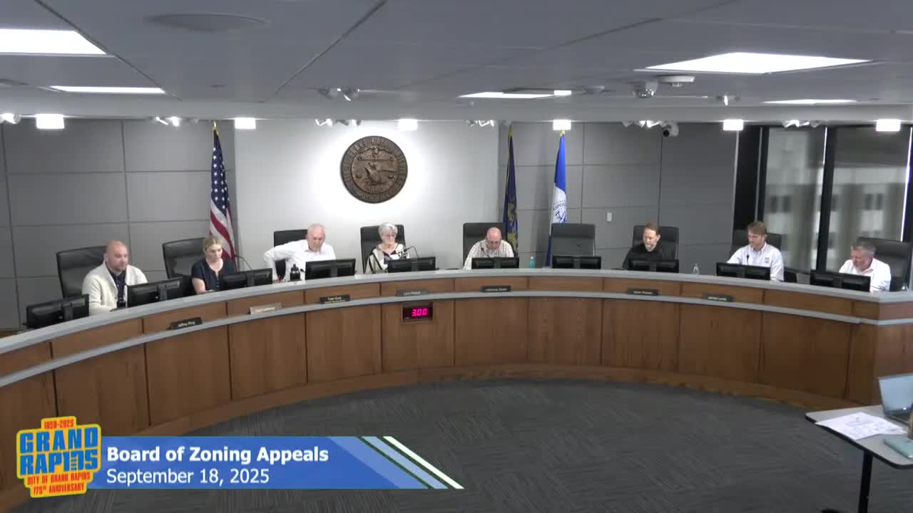 Board allows replacement of riverfront parking at 1440 Front Ave NW; finds environmental limits make landscaping infeasible