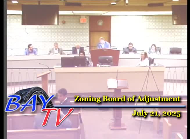 Zoning board approves three townhouses at 696–698 JFK Boulevard with variances and conditions