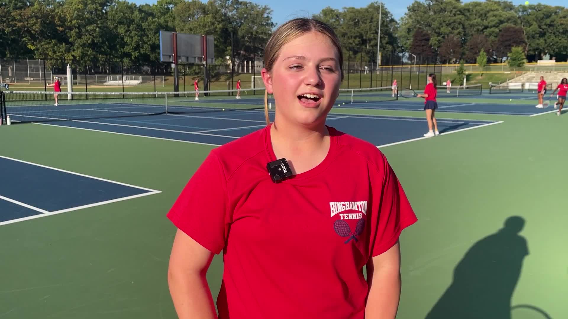 Eighth-grader describes experience playing on varsity tennis team