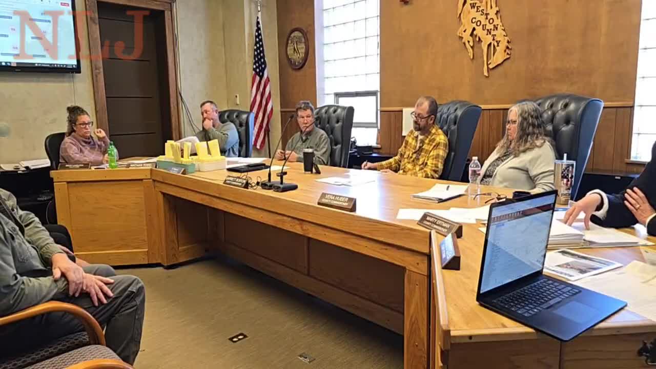 Commission debates how to record victim‑services grant and related budget adjustments