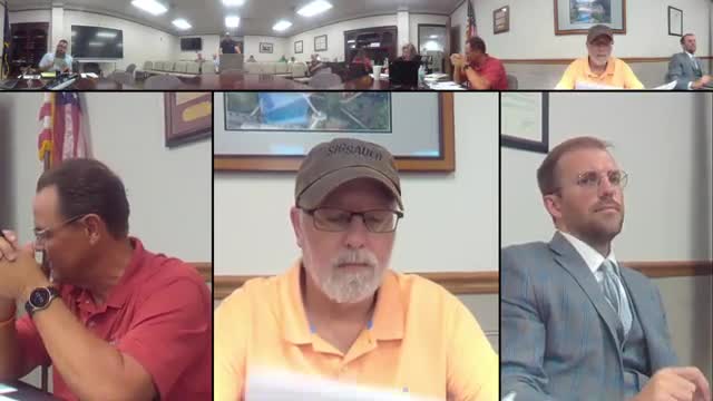 Commissioners approve burn ban, stop‑sign ordinances and several county actions; other items tabled