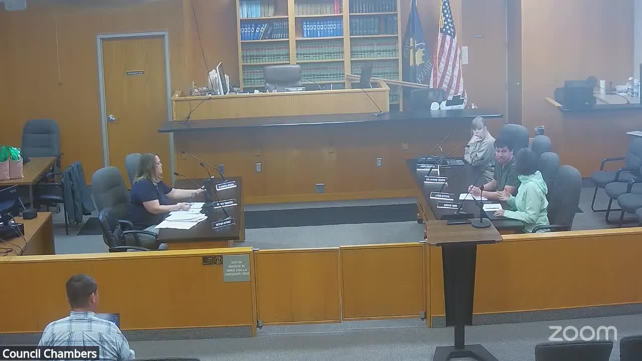 City staff outlines downtown vault‑closure work, Parking Lot Q paving and corridor design study