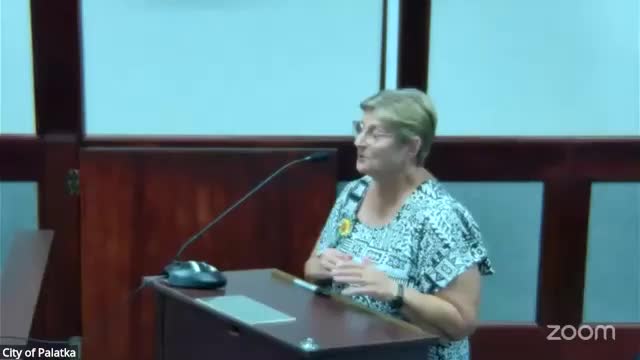 Resident questions Tillman House siding specification during public comment