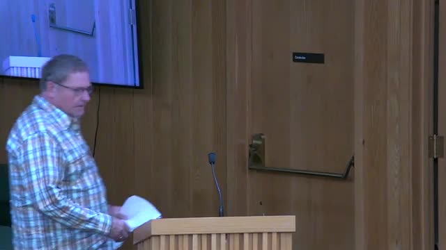 Resident warns commissioners of heavy drain assessments, urges relief for affected families