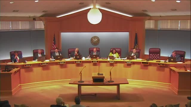 Council adopts ordinance to allow one electronic message board per subdivision with limits; public raises constitutional and nuisance concerns