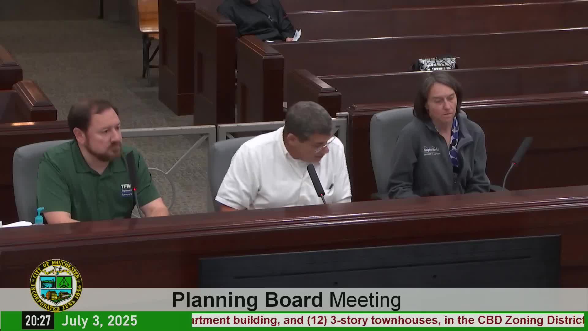 NeighborWorks seeks year extension and garage façade review for downtown mixed-use project; board asks for brick color options and accessibility clarifications