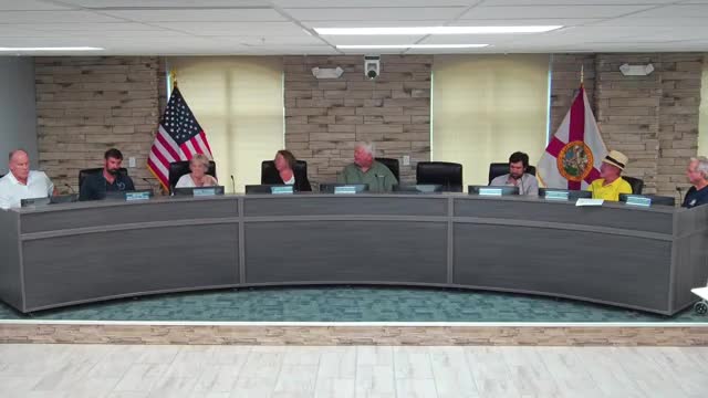 Town staff reports contractor completion, liquidated damages terms and dune plantings; iguanas reported damaging plantings