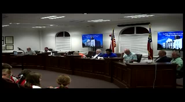 Commissioners discuss awarding county roofing work to lower‑cost bidder; tourism and development authorities’ contributions questioned