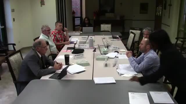 Administrator experimenting with AI to produce "informed risk" documents; staff caution on HIPAA and data storage