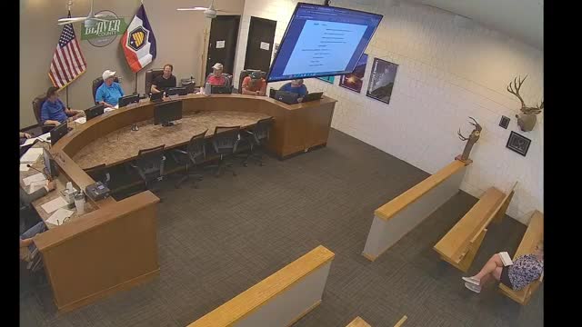 Developer proposes relocation and upgrade of main water line; district outlines conditional cost‑share and requirements