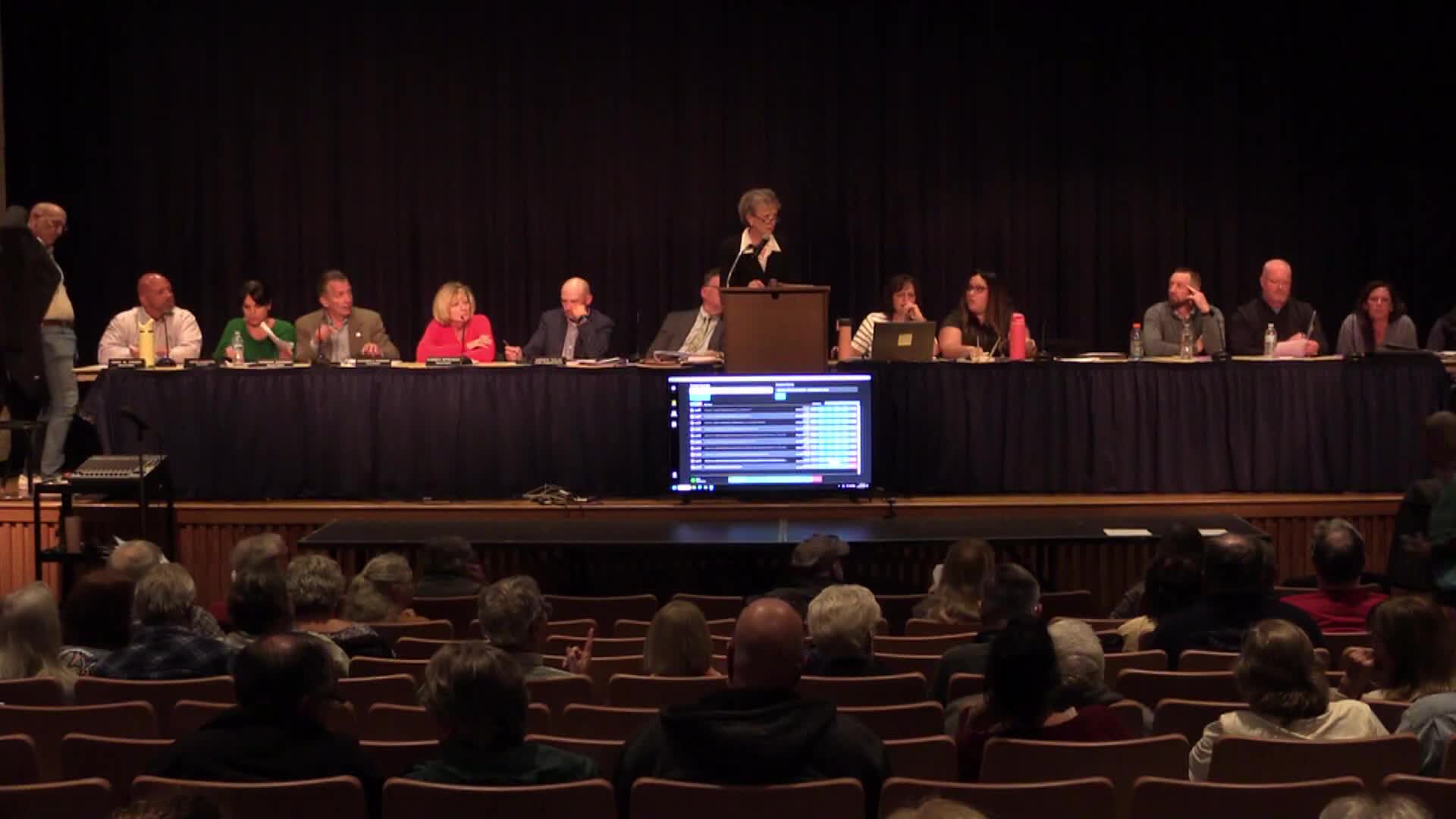 Two citizen firearm exemption proposals fail after extended debate; library exclusion carried as amendment then rejected