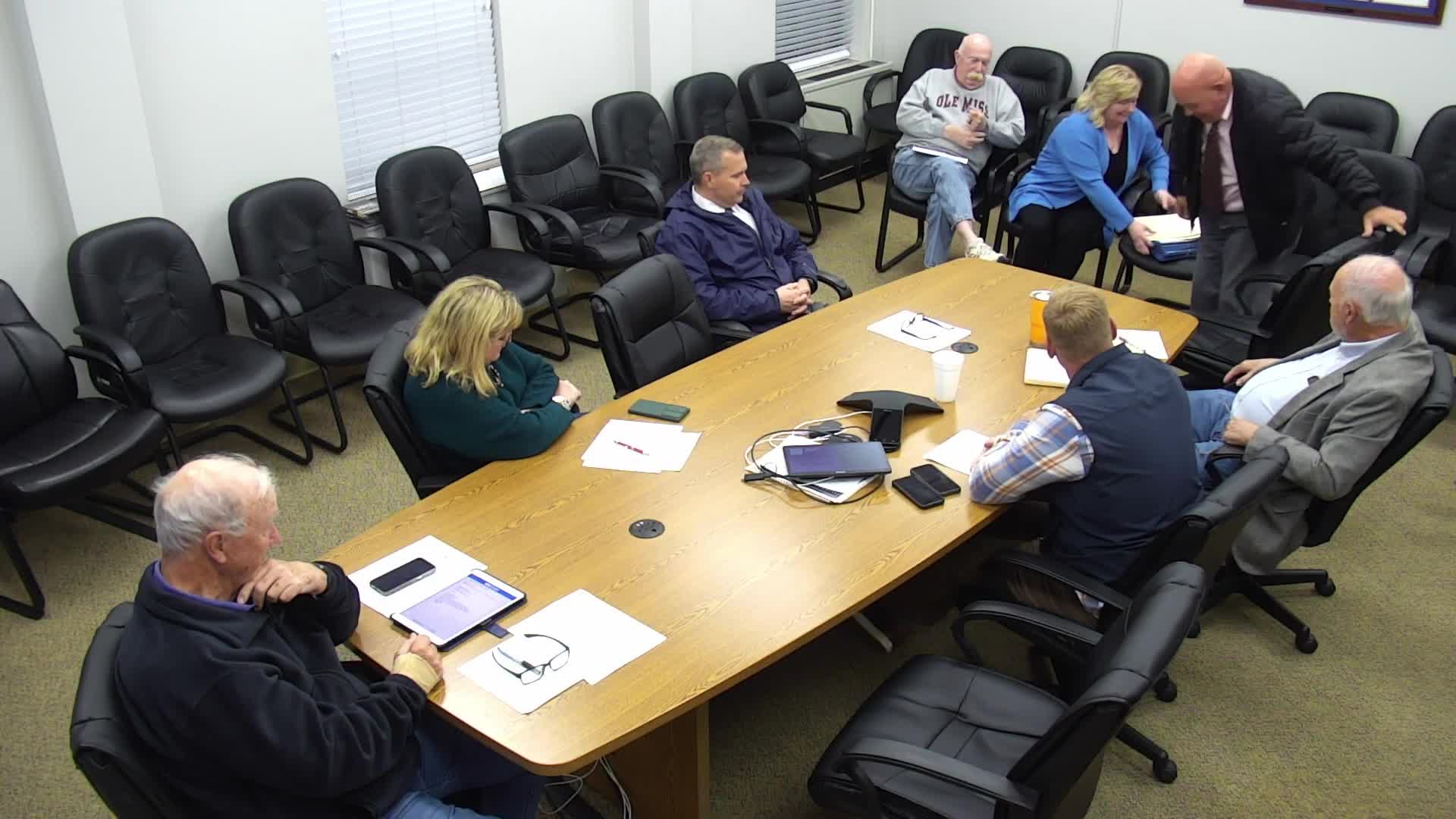 Commissioners discuss $72,000 transfer to replace failing archival shelving; item referred to budget committee