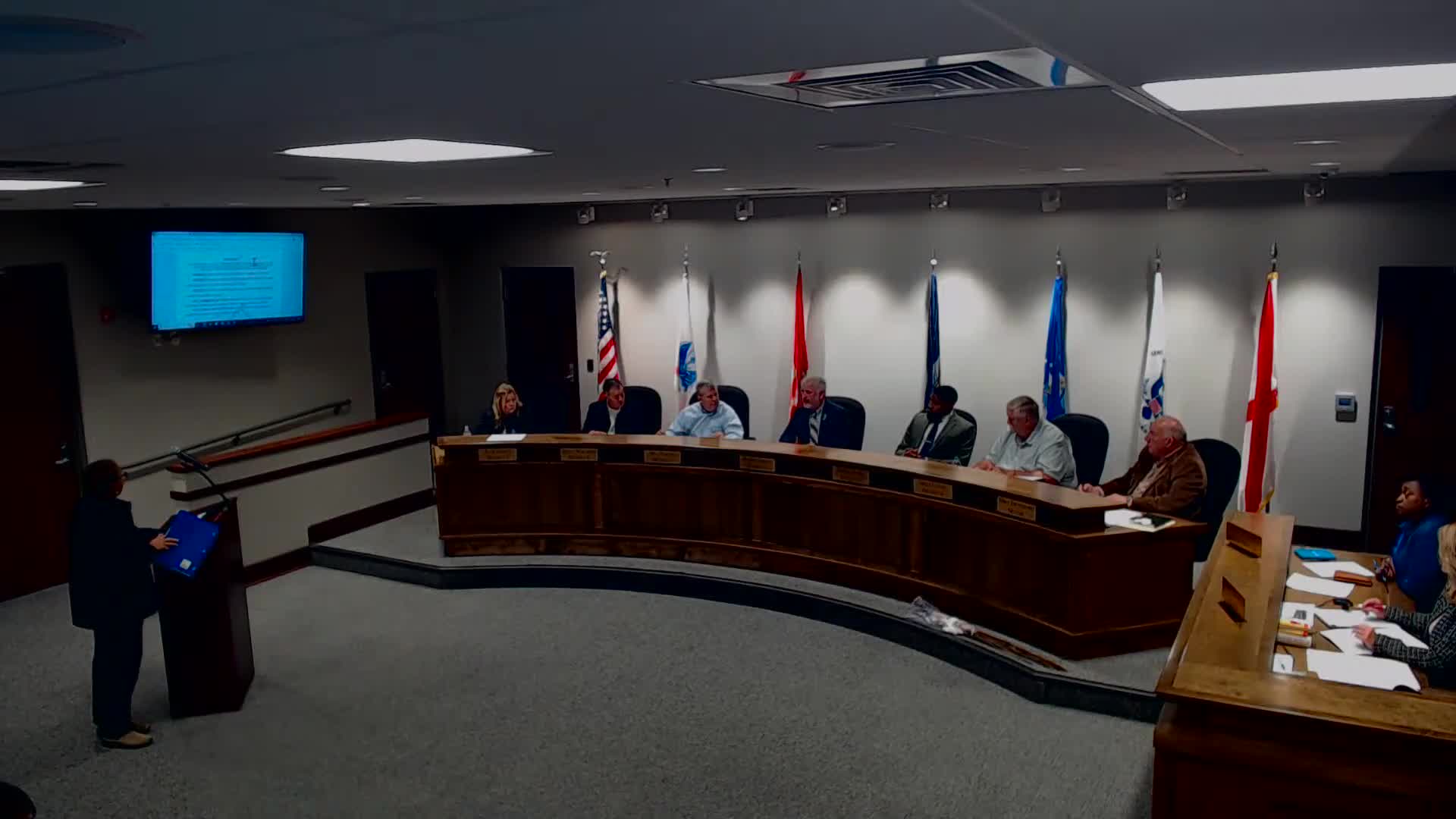 Residents report split utility pole and cluster of stray dogs; city staff and police describe limited removal options