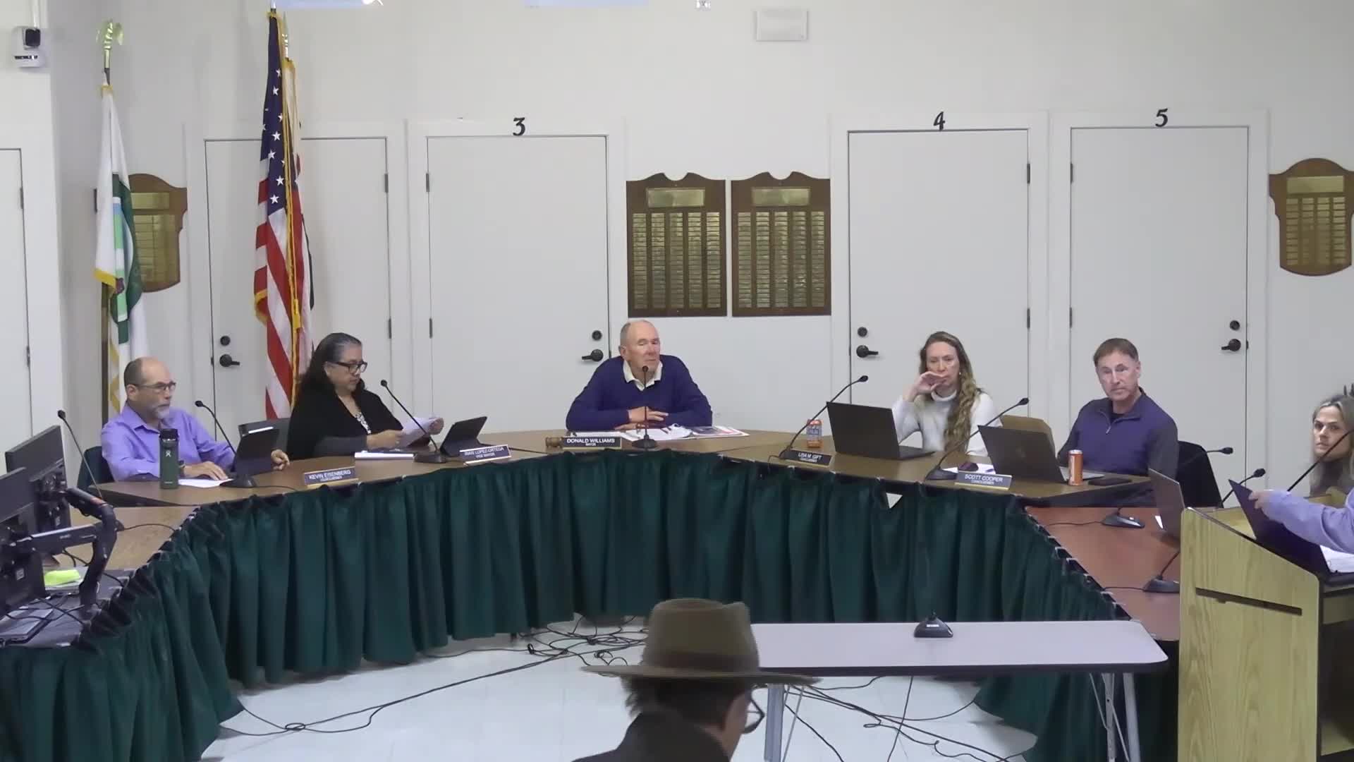 Council awards police building painting contract amid debate over local bidding