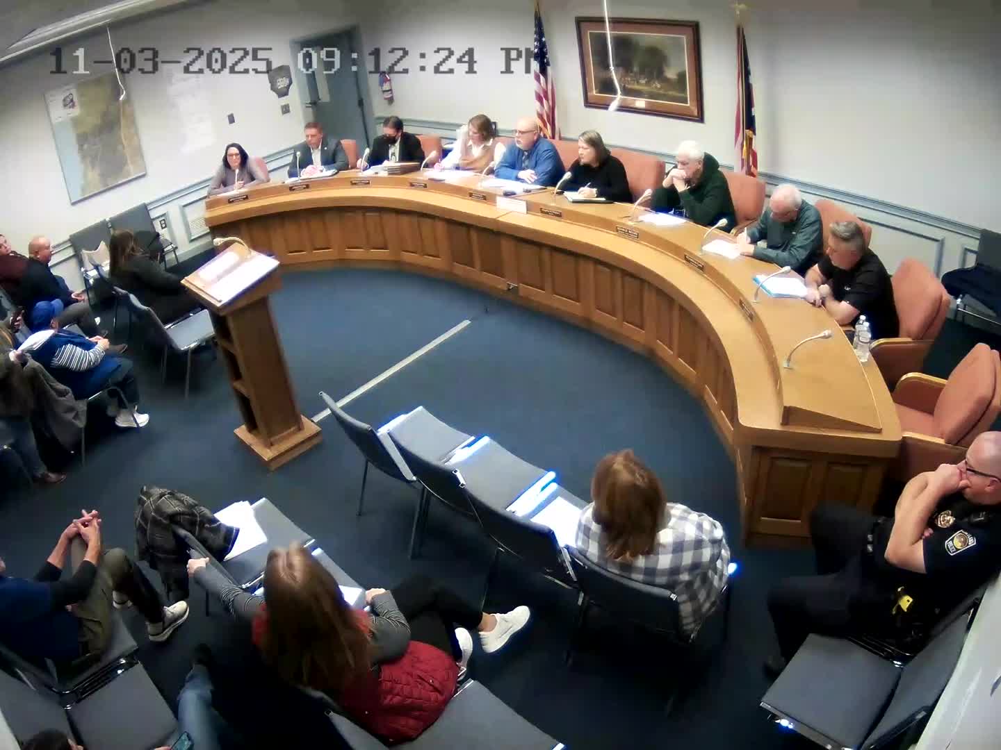 Resident questions council residency and past statements during public comment