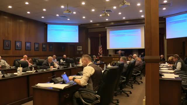 Commissioners press schools for details on reallocating funds to contracted mowing as staff voice concern