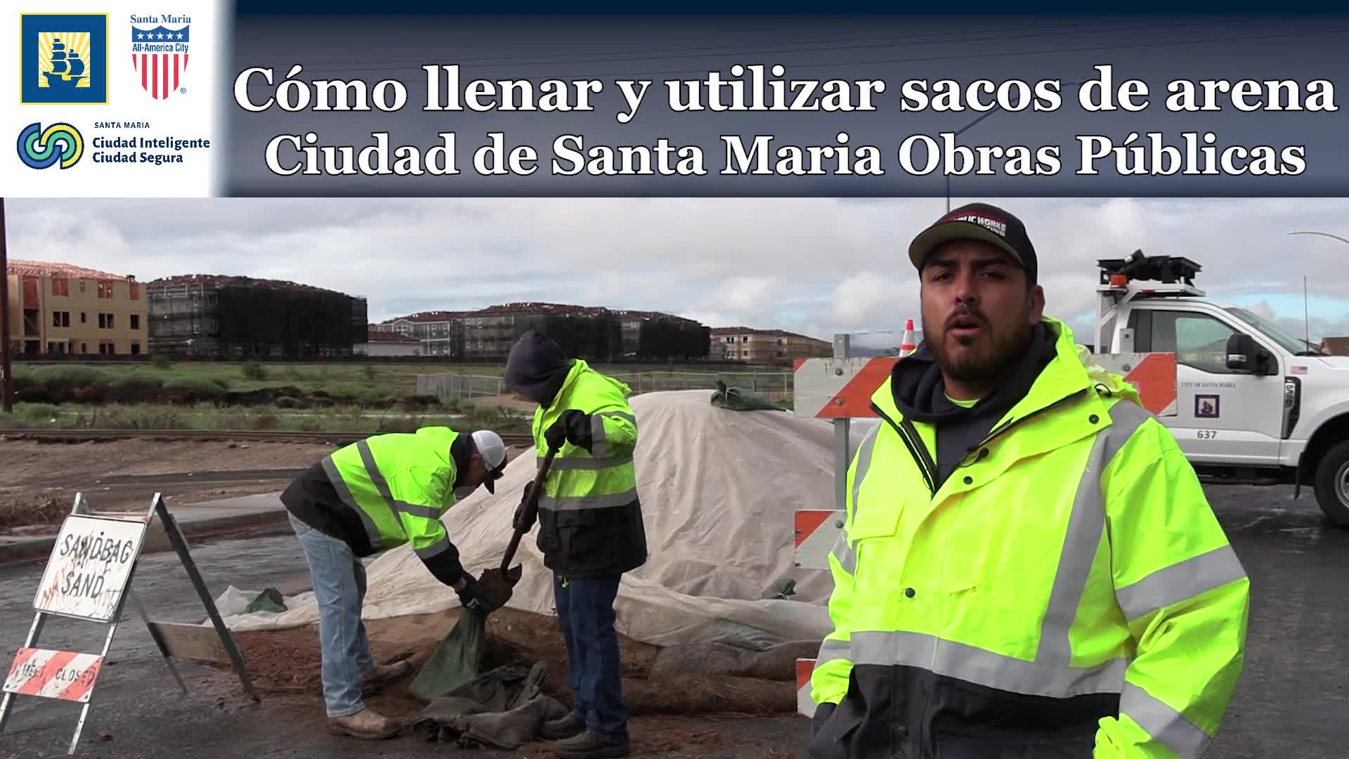 Santa Maria employee demonstrates how to fill sandbags; city provides sand but not bags