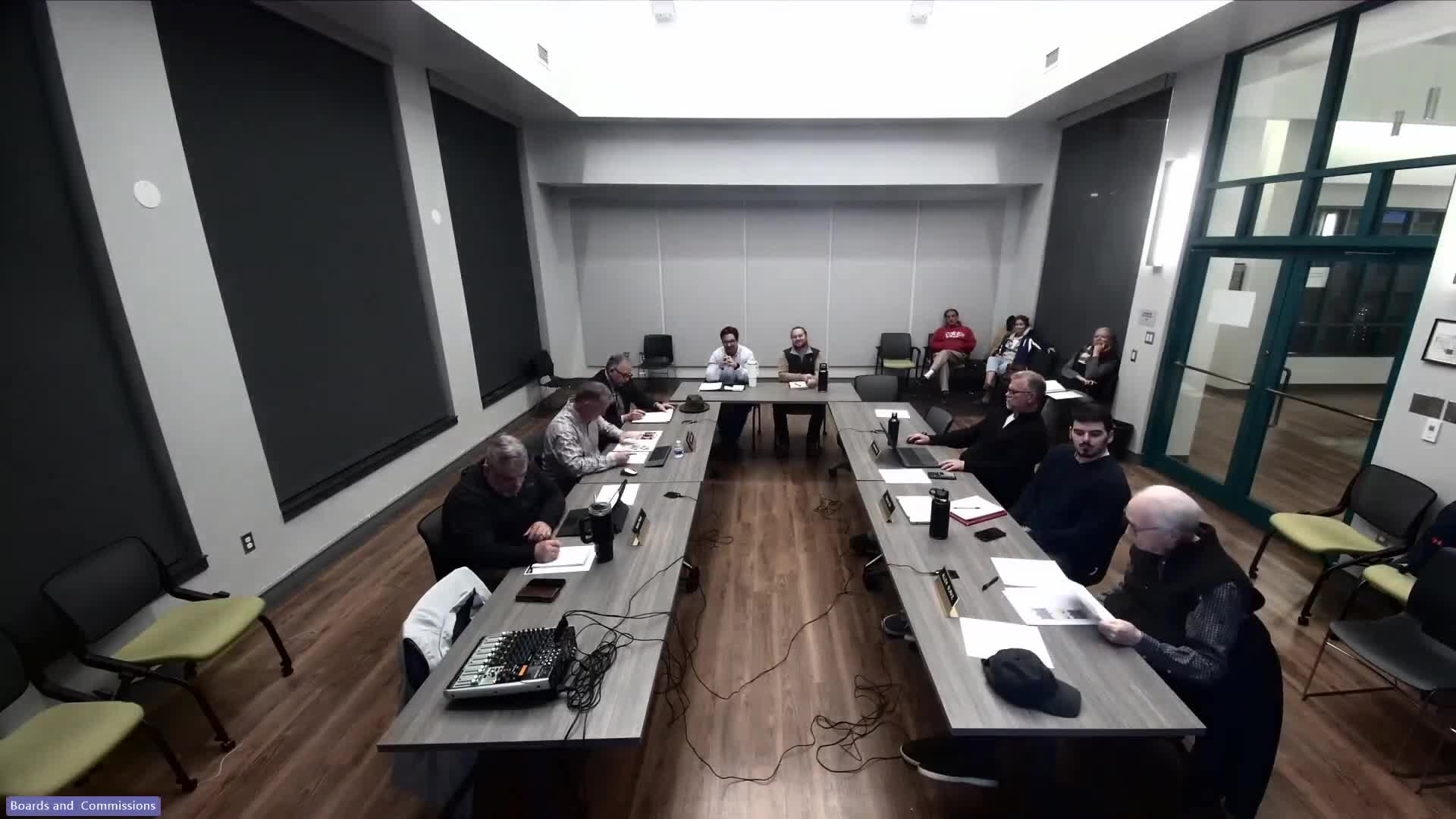 Developer presents revised townhome sketch for 615–617 South Walnut; commission presses for buffering, stormwater and parking details