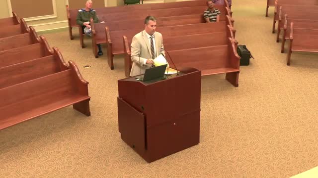 Commission postpones action and staff refers duplex variance at 127 13th Street to city council