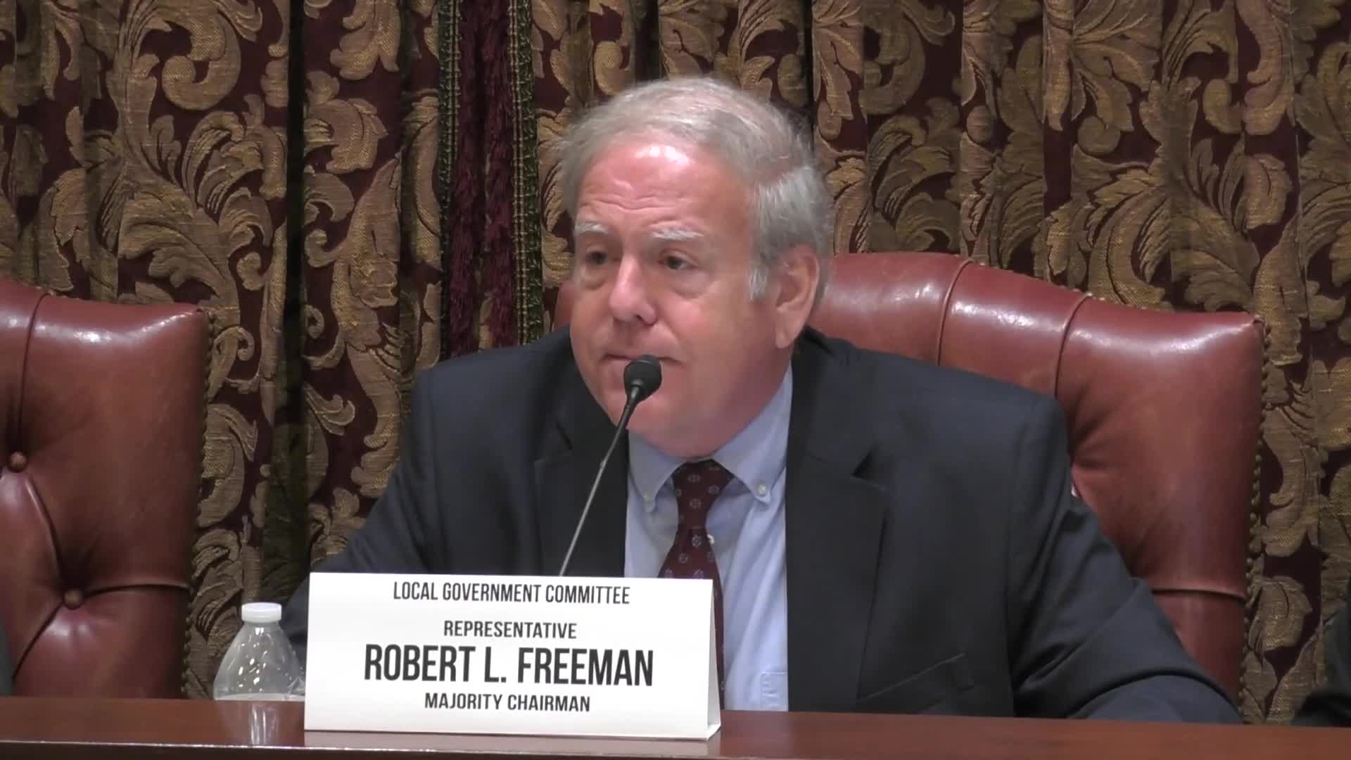 Committee reports bill clarifying when municipalities may hold remote meetings and emergency succession rules