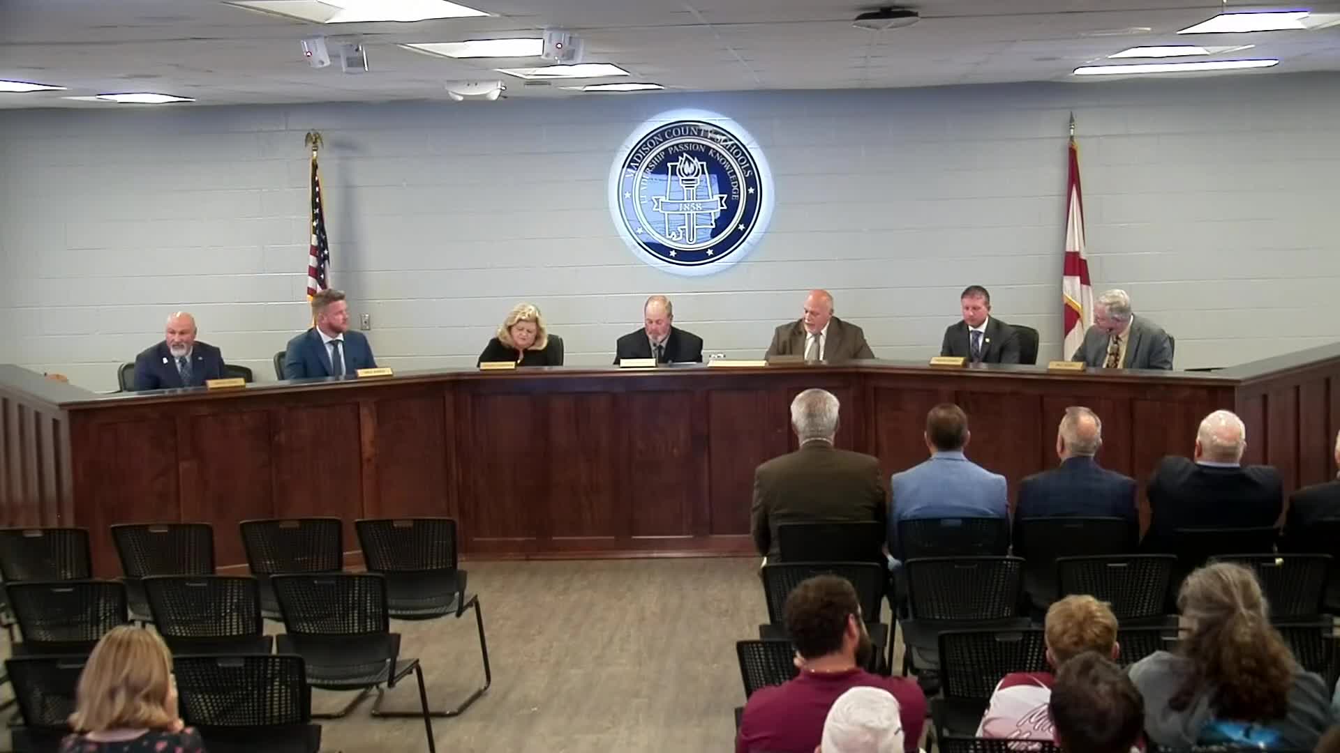 County commission gives check to Madison County Schools for high-school cameras