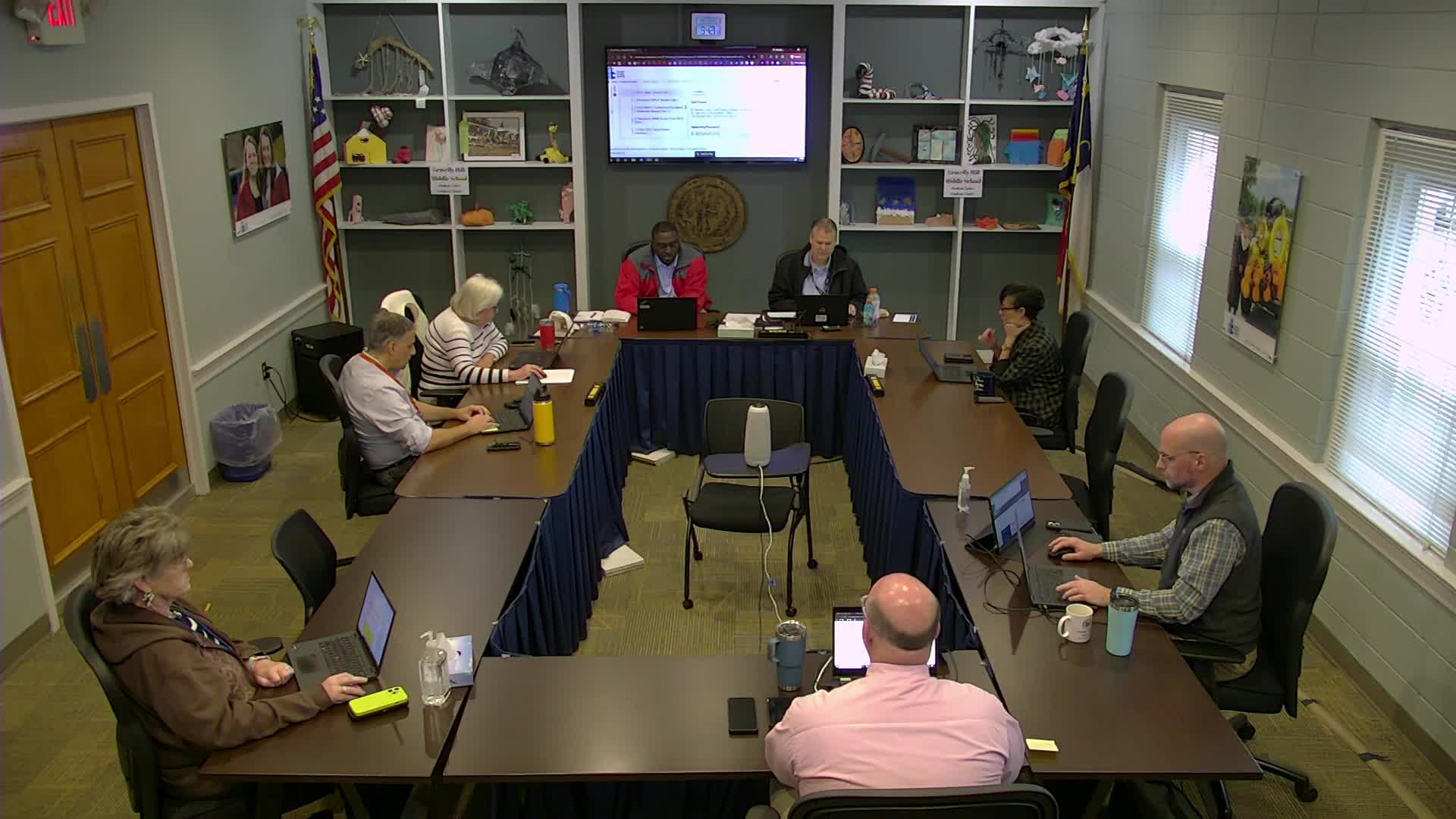 Committee moves volunteer screening updates and student-fee procedure changes to first reading; asks staff to streamline website posting