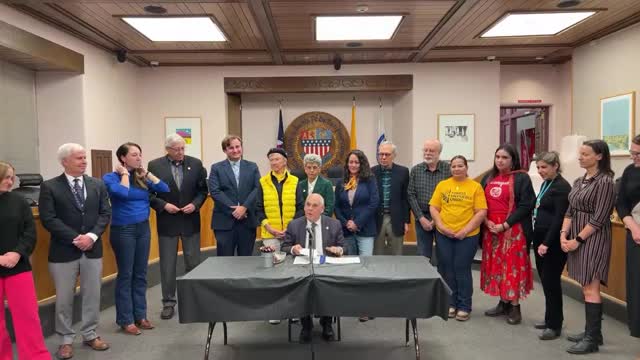 Santa Fe ceremony marks signing of bill the speaker says will raise living wages for local workers