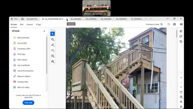 Commission splits West Poplar application; doors and two nonhistoric windows approved amid debate over historic window replacements