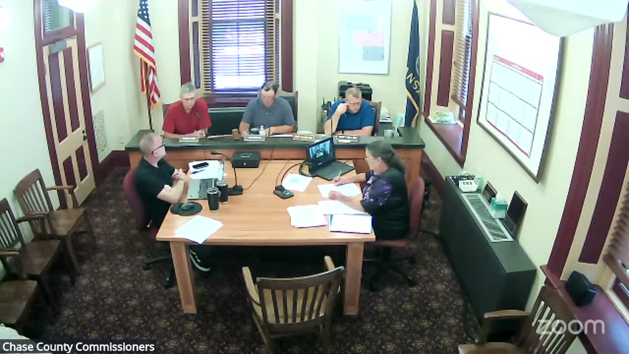 Chase County OKs quick‑attach mower and grapple for road crew; discusses trailers and skid‑loader replacement